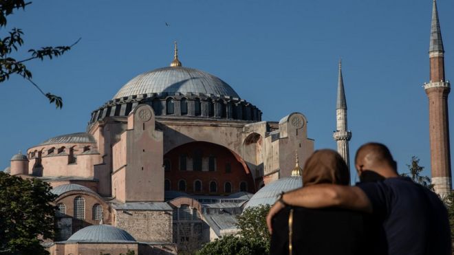 A couple stand in front of Istanbul's famous Hagia Sophia, 22 July 2020