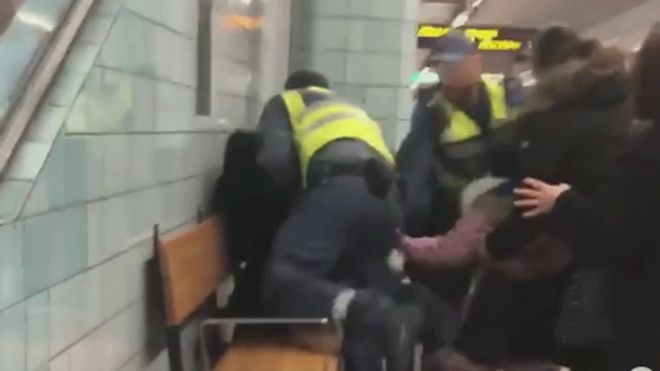 Video grab of the woman being overpowered on the Stockholm metro