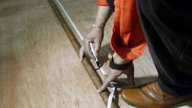 The world"s longest cigar rolled up by Cuban Jose Castelar Cairo, known as "Cueto", is measured in Havana, Cuba, 12 August 2016