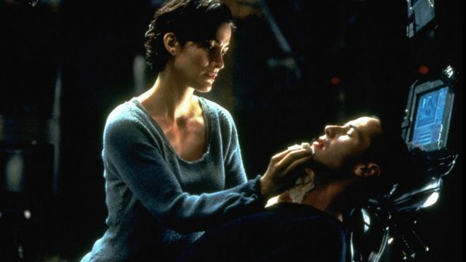 Carrie-Anne Moss and Keanu Reeves star in the original 1999 film