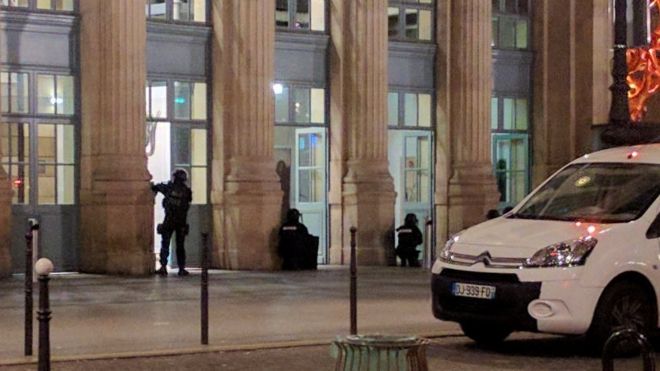 Police officers are seen at an entrance of the Paris Gare du Nord in Paris