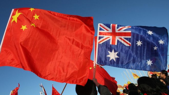 The Chinese and Australian flags flown by protesters in Canberra
