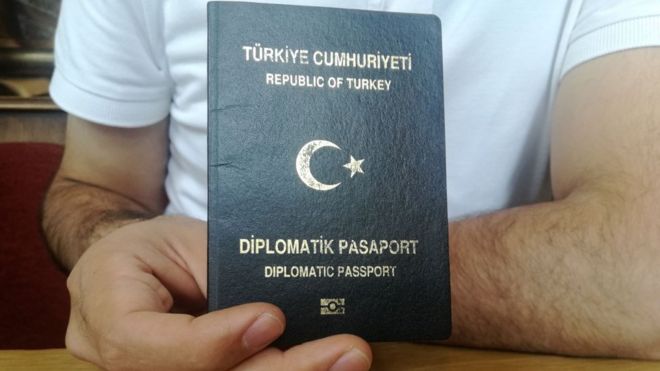 Military officer holding diplomatic passport