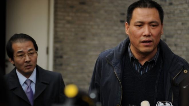 Pu Zhiqiang (R), the civil rights lawyer for Chinese artist Ai Weiwei, talks to the media at the artists studio in Beijing on November 14, 2011