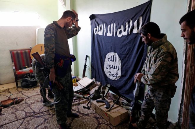 SDF fighters with a captured IS fag