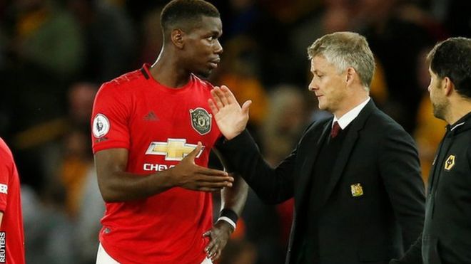 Paul Pogba (left) and Manchester United manager Ole Gunnar Solskjaer