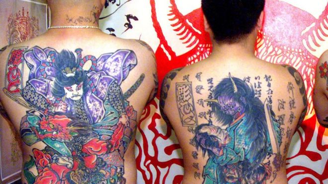 Japanese men showing off their back tattoos