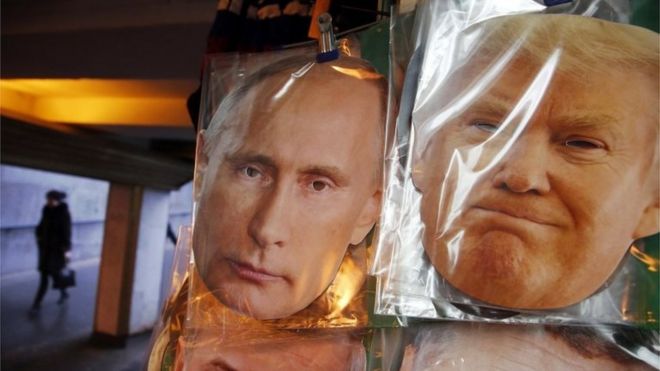 Face masks depicting Russian President Vladimir Putin and U.S. President-elect Donald Trump hang for sale at a souvenir street shop in St.Petersburg, Russia, on 23 December 2016.