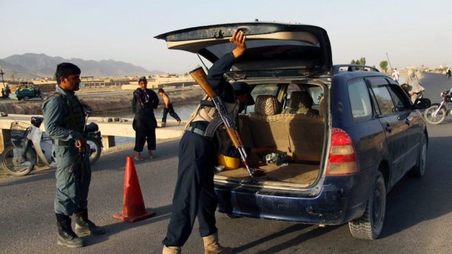 Police conduct a vehicle search in Kandahar after the reported kidnapping