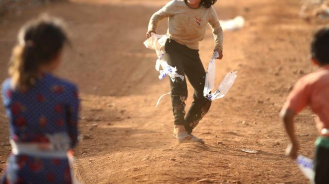 Children, with identities hidden, in a camp near Idlib