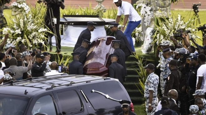 Pallbearers carry the coffin of late Ivorian singer DJ Arafat leaves the Felix Houphouet-Boigny stadium in Abidjan