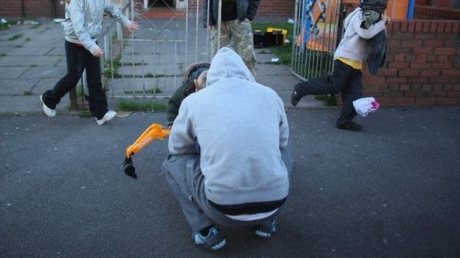 Family outside council house in Salford