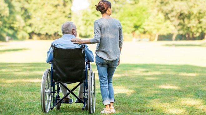 Elderly man in wheelchair