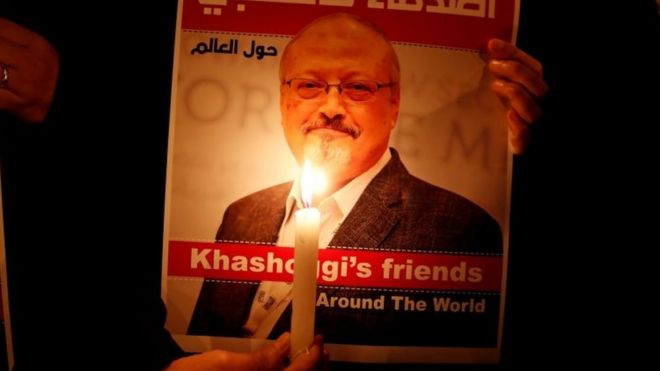 A demonstrator holds a poster with a picture of Saudi journalist Jamal Khashoggi outside the Saudi Arabia consulate in Istanbul,