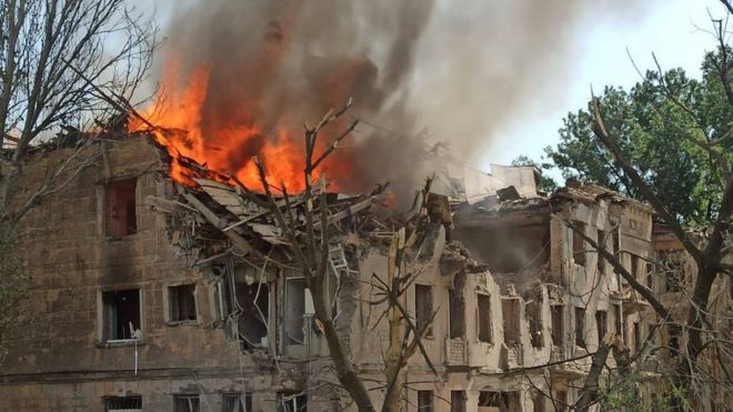 Fire burns out of a damaged building in Dnipro, Ukraine