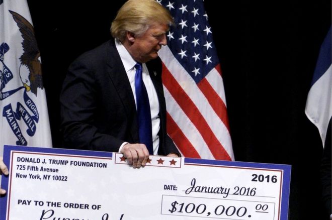 Trump presents a cheque
