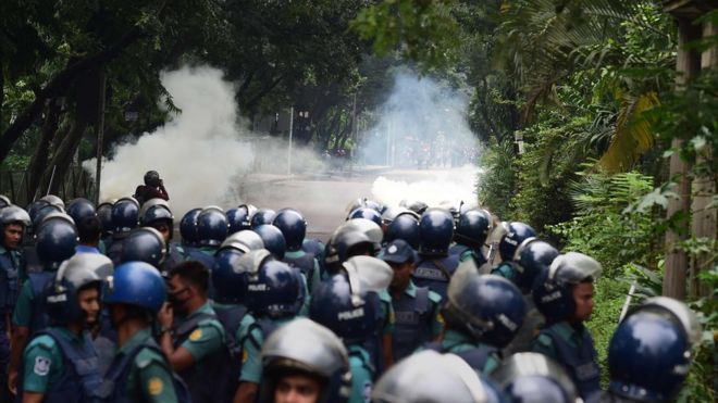 Bangladeshi police fire tear gas shell during clashes with students during a protest in Dhaka on August 5