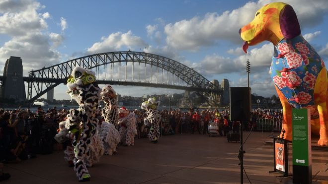 Lion dancers perform in front of the Sydney Harbour Bridge and Opera House at the start of the Lunar New Year Festival in Australia on February 16, 2018.