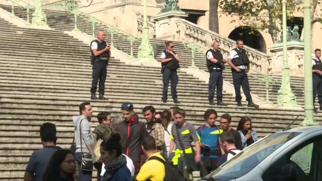 Police stand on the steps leading to Marseille train station