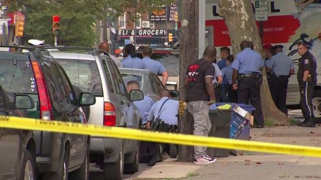 The gunman opened fire as officers served a drug warrant at a home in Philadelphia