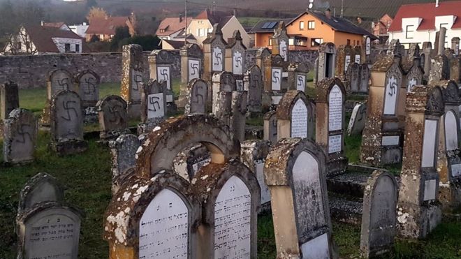 Картинки по запросу Dozens of Jewish gravestones daubed with swastikas in eastern France