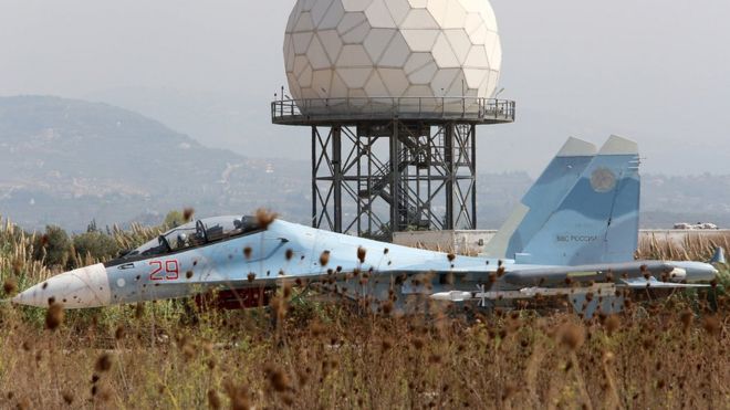 A Russian Sukhoi SU-30 SM jet fighter standing on a runway at the Hmeimim airbase in Syria