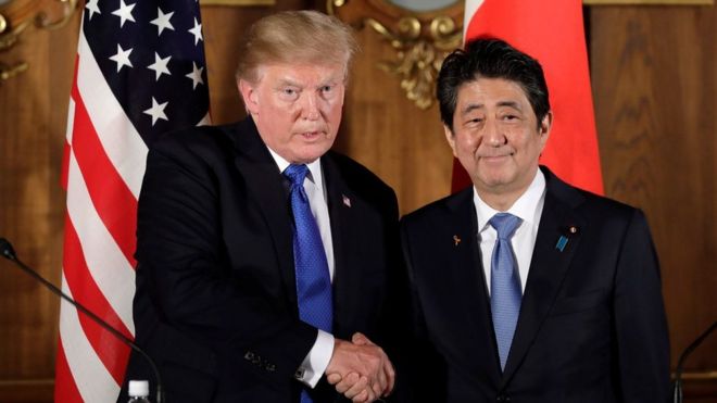 US President Donald J. Trump (L) shakes hands with Japan's prime minister Shinzo Abe (R) during a news conference at Akasaka Palace in Tokyo, Japan, 6 November 2017