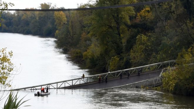Emergency services searching the river around the collapsed bridge.