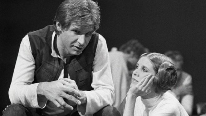 Harrison Ford talks with Carrie Fisher during a break in the filming of the CBS-TV special "The Star Wars Holiday" in Los Angeles