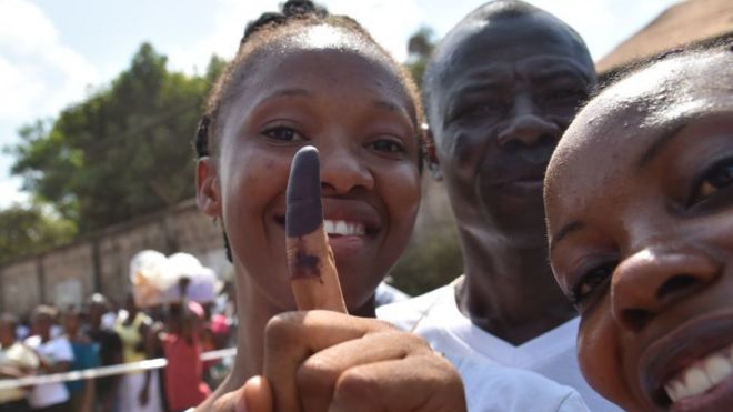Woman dey smile show as she don vote