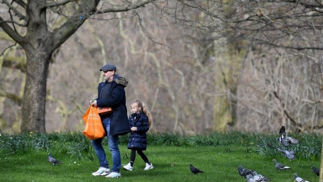 Members of the Public walk round St James"s Park on March 21, 2020 in London, England