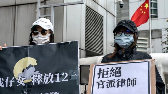 Family members of the Hong Kong residents detained in China protest outside the Liaison Office of the Central People's Government, 30 September 2020 in Hong Kong, China
