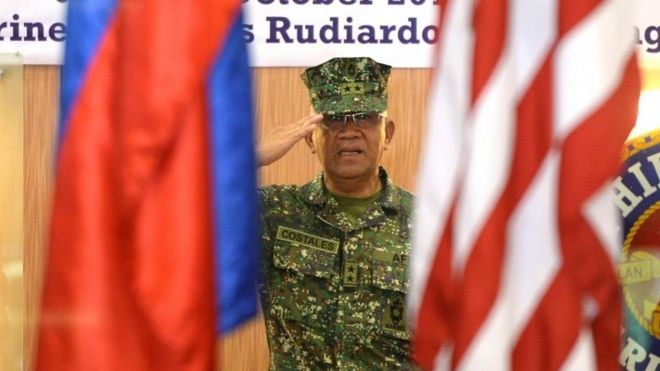 Philippines marines commandant Major General Andre Costales salutes during the opening ceremony of the Amphibious Landing Exercise (PHIBLEX) at the marines headquarters in Manila on October 4, 2016.