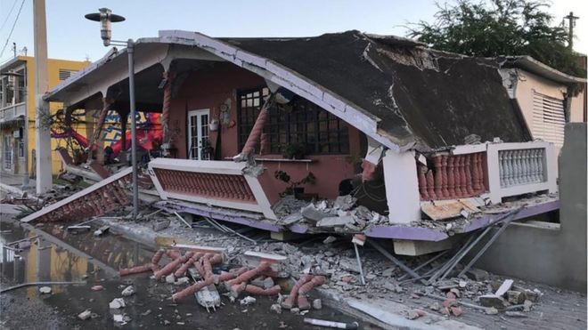 A home is seen collapsed after an earthquake in Guanica