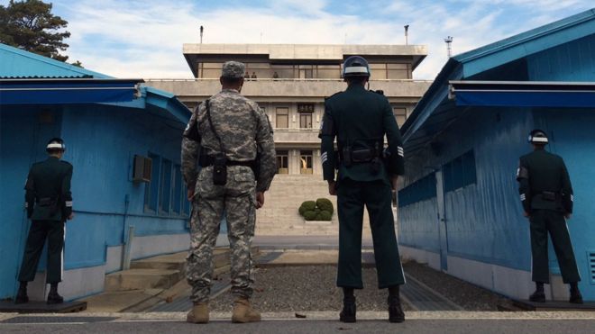 South Korean soldiers look at the North side across the border in the truce village of Panmunjom