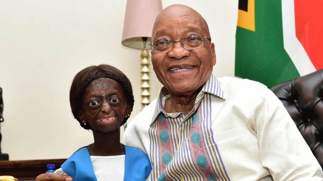 Ontlametse Phalatse standing and smiling next to Jacob Zuma