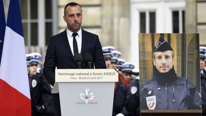 Etienne Cardiles pays tribute to his slain partner Xavier Jugelé (pictured, right) at a ceremony in Paris. Photo: 25 April 2017