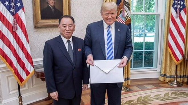 Trump holding letter