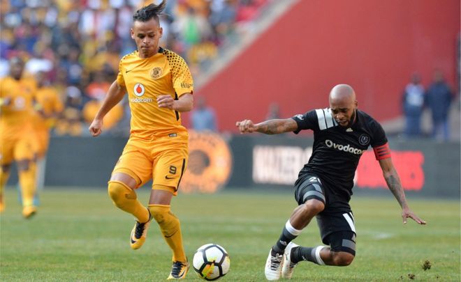 Gustavo Paez and Oupa Manyisa during the Carling Black Label Champion Cup match between Orlando Pirates and Kaizer Chiefs at FNB Stadium on July 29, 2017