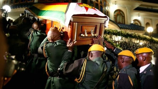 The body of former Zimbabwean President Robert Mugabe arrives at the Blue Roof, his residence in Borrowdale, Harare, Zimbabwe, on 11 September 2019