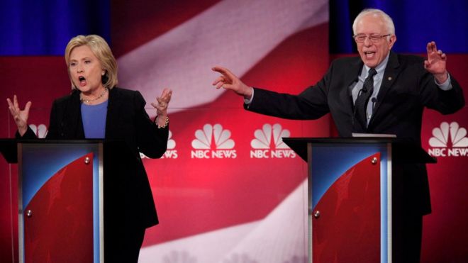Democratic U.S. presidential candidate and former Secretary of State Hillary Clinton and rival candidate U.S. Senator Bernie Sanders speak simultaneously at the NBC News - YouTube Democratic presidential candidates debate in Charleston, South Carolina January 17, 2016