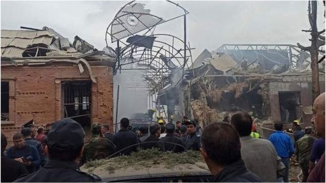 Crowds look at destroyed buildings in Ganja. Photo: 4 October 2020