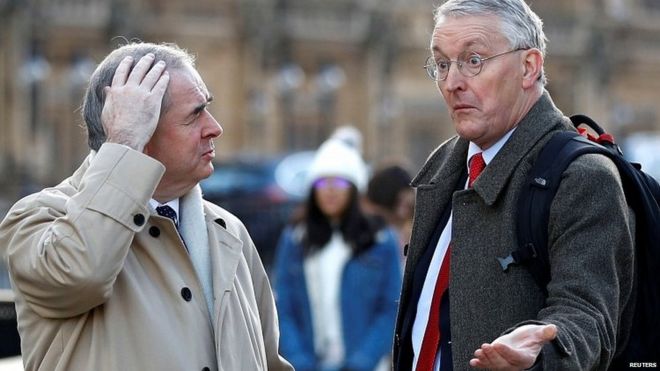 Attorney General Geoffrey Cox talking to Labour MP Hilary Benn outside Parliament