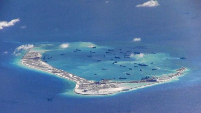 Chinese dredging vessels in the waters around Mischief Reef