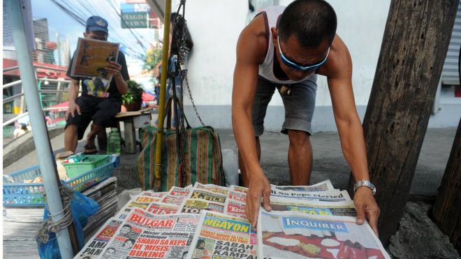 Филиппинский газетный продавец