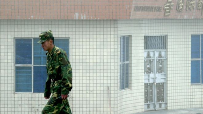A Chinese soldier stands guard on the Chinese side of the border in 2008