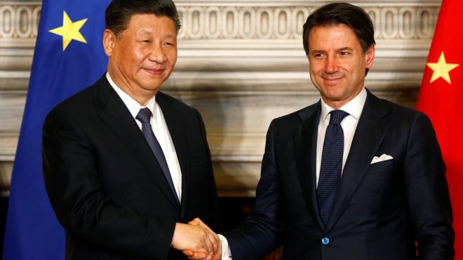 Italian Prime Minister Giuseppe Conte and Chinese President Xi Jinping shake hands after signing trade agreements at Villa Madama in Rome,