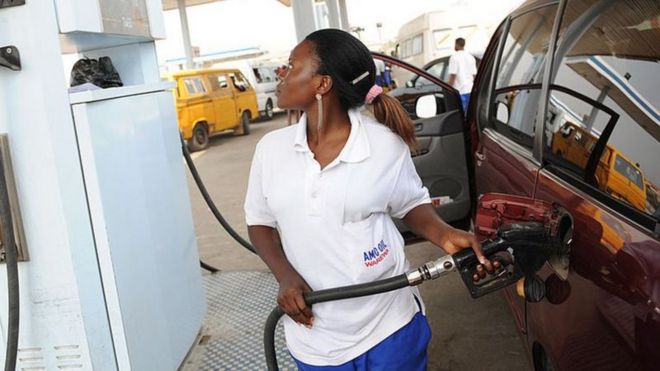 Female fuel attendant in Africa