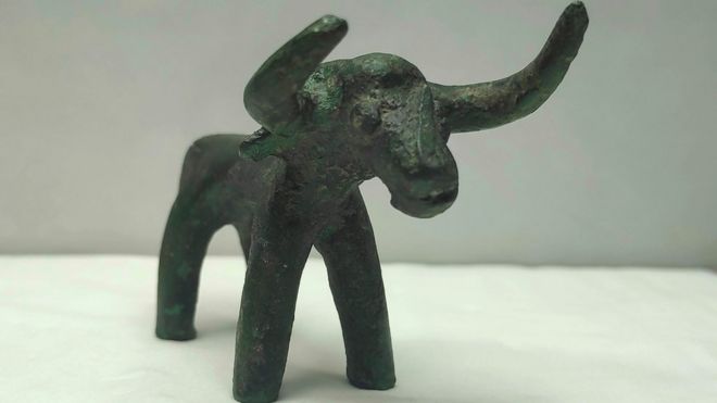 A 2,500-year-old bronze bull idol that was unearthed at the archaeological site of Olympia is displayed in a laboratory, in ancient Olympia, Greece, 1 March 2021