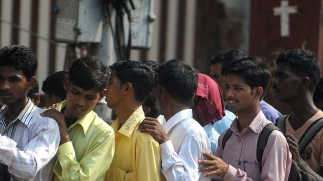 Indian youth queue at a jobs fair in Mumbai on October 12, 2011.